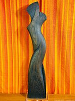 Full view of sculpture front on lucite base