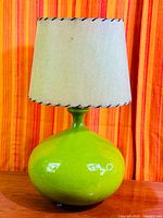 Full view of green ceramic lamp with shade