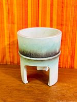 Front view of footed planter showing bowl and pedestal