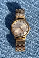 Front view of Longines Admiral watch on blue background