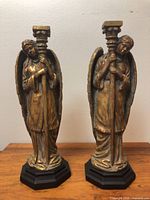 Front view of both angel candlestick holders
