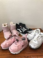 Group shot of all four pairs of toddler shoes