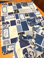 Folded Star Wars print sheets on table