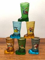 Stacked view showing shape, colors and decals of five glasses