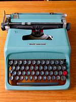 Front view of Olivetti Underwood Studio 44 typewriter showing keyboard, colour, branding