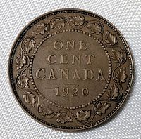 Reverse side showing denomination, country, date, maple leaf wreath
