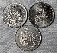 Front view of three Canadian 50-cent coins dated 1978, 1981, 2000