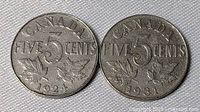 Both five-cent coins reverse side