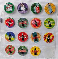 Full view of binder sleeve showing 15 Coca-Cola pogs