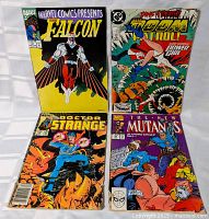 All four comic books front covers visible
