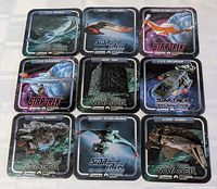 All nine Star Trek coasters laid out in 3×3 grid