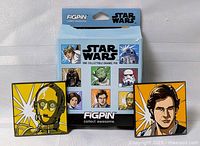 Front view of packaging with two enamel pins displayed