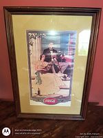 Front view of framed Coca-Cola print showing artwork, mat and frame