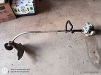 Full view of Echo GT-200 trimmer showing curved shaft and guard