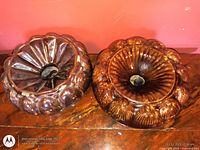 Top view of both ribbed brown ceramic spittoons
