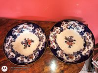 Front view of both plates showing decoration and overall condition