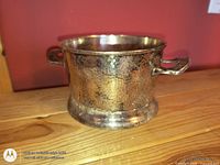 Oblique view showing hammered texture and handle