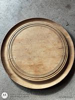 Top view of round maple bread board with concentric rings