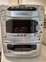 Front view of Panasonic SA-AK29 stereo system showing 5-CD changer, dual cassette, controls