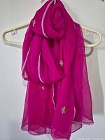 Shawl hung on hanger showing full length and color