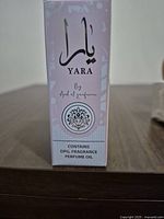 Side view of Yara perfume oil box showing branding and contents statement