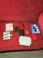 Entire lot arranged on red couch