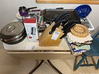 Overview of assorted kitchenware items on table