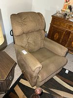 Front angled view of brown La-Z-Boy recliner showing upholstery and lever