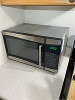 Overall view of Sunbeam microwave on countertop
