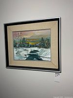 Framed oil painting on wall