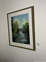 Framed painting on wall showing overall piece