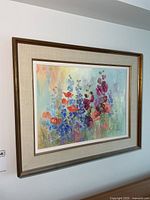 Framed floral oil painting on wall