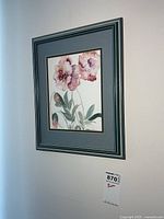 Framed watercolour painting on wall