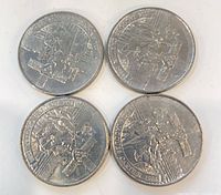 Front view of four 1984 Canadian dollar coins