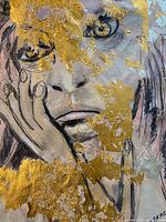 Close-up of upper face and hand detailing with gold foil application