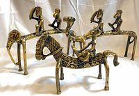All four brass equestrian figurines front view