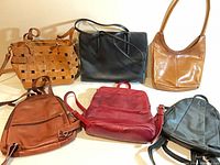 Overview of all six leather bags upright