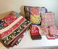 Folded patchwork quilt, patchwork Euro sham, rose-print square pillow cover, additional rose-print covers