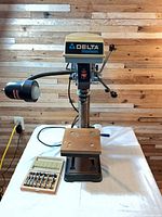 Full view of Delta ShopMaster tabletop drill press on table