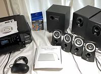 Overall lot showing printer, speakers, cartridges, DVD-RW drive, mouse