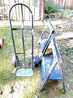 Milwaukee hand truck and two StoreHorse sawhorses set on grass