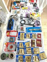 Full view of assorted packaged hardware on table