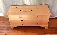 Closed pine chest, front and top view