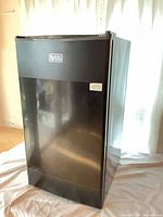 Front view of Black+Decker mini refrigerator closed
