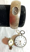 Sterling cuff wristwatch, glass orb watch, pocket watch overview