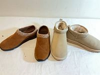 Top view of both pairs of shoes on white surface