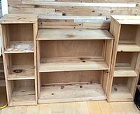 Three pine bookcases side by side