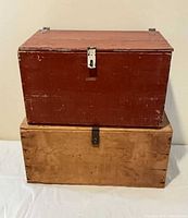 Front view of both chests stacked, showing size, color, hardware, paint wear