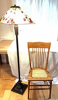Overall view of floor lamp and chair together