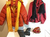 Full view of both jackets, scarves, gloves and hat